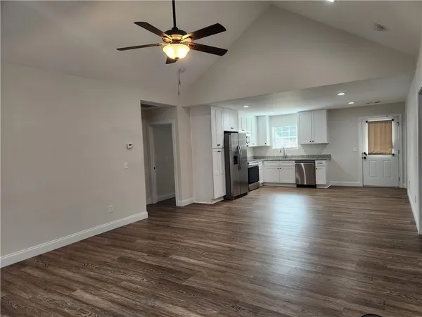 a view of a kitchen with a microwave and a stove