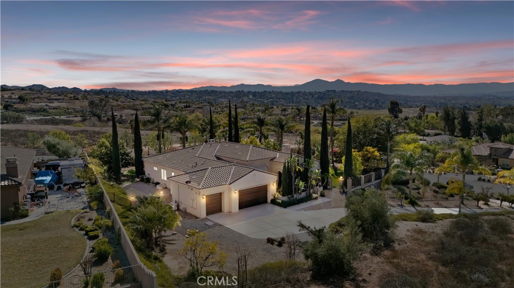 7780 Solitude Court Riverside, CA 92506 - Photo 1 of 63 an aerial view of a house with a mountain