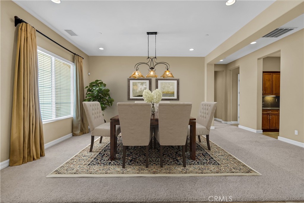 7780 Solitude Court Riverside, CA 92506 - Photo 17 of 63 a view of a dining room with furniture window and wooden floor