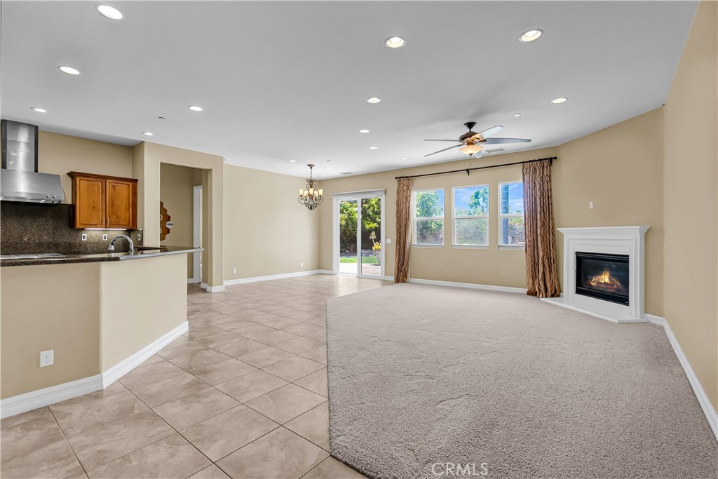 7780 Solitude Court Riverside, CA 92506 - Photo 20 of 63 a view of an empty room with a fireplace and a window