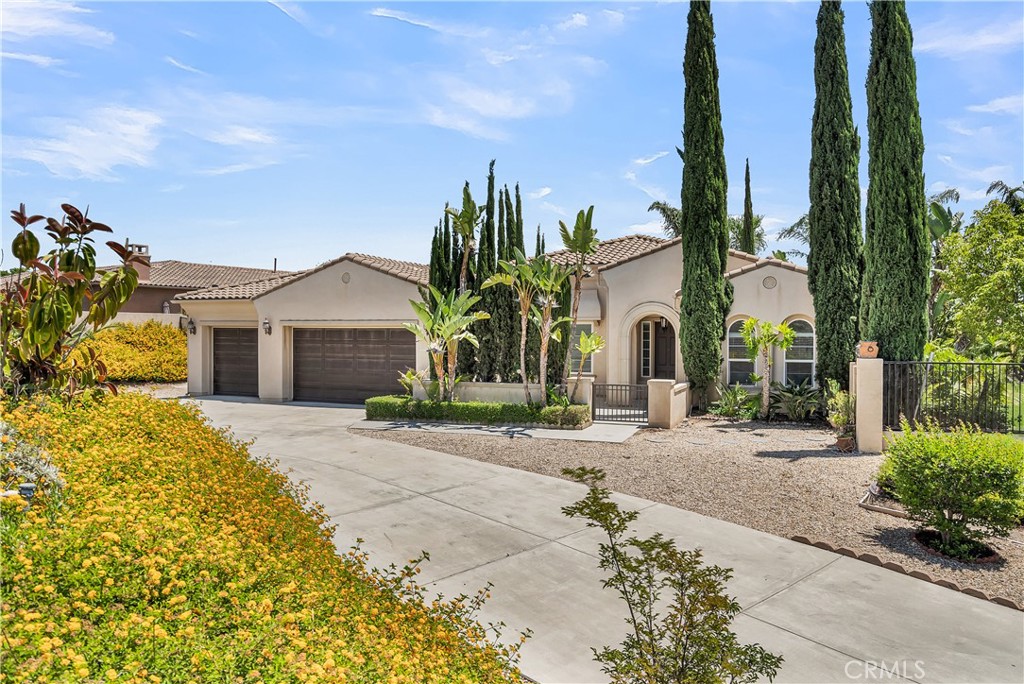 7780 Solitude Court Riverside, CA 92506 - Photo 2 of 63 a front view of a house with garden