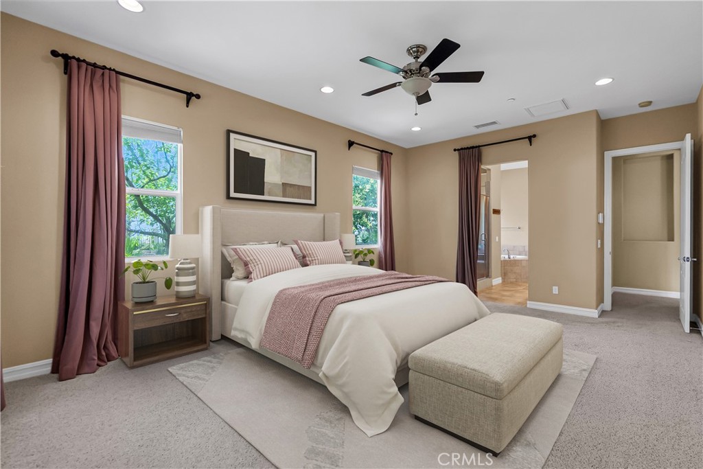 7780 Solitude Court Riverside, CA 92506 - Photo 30 of 63 a spacious bedroom with a bed and ceiling fan