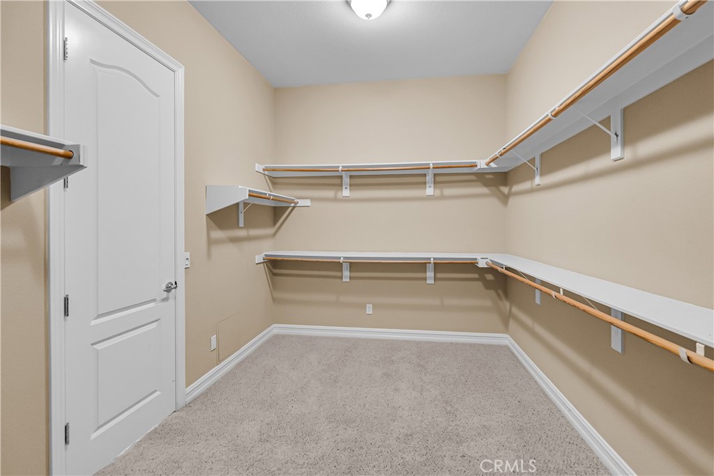 7780 Solitude Court Riverside, CA 92506 - Photo 36 of 63 a view of walk in closet with empty racks