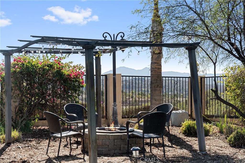 7780 Solitude Court Riverside, CA 92506 - Photo 56 of 63 a patio table with chairs and potted plants