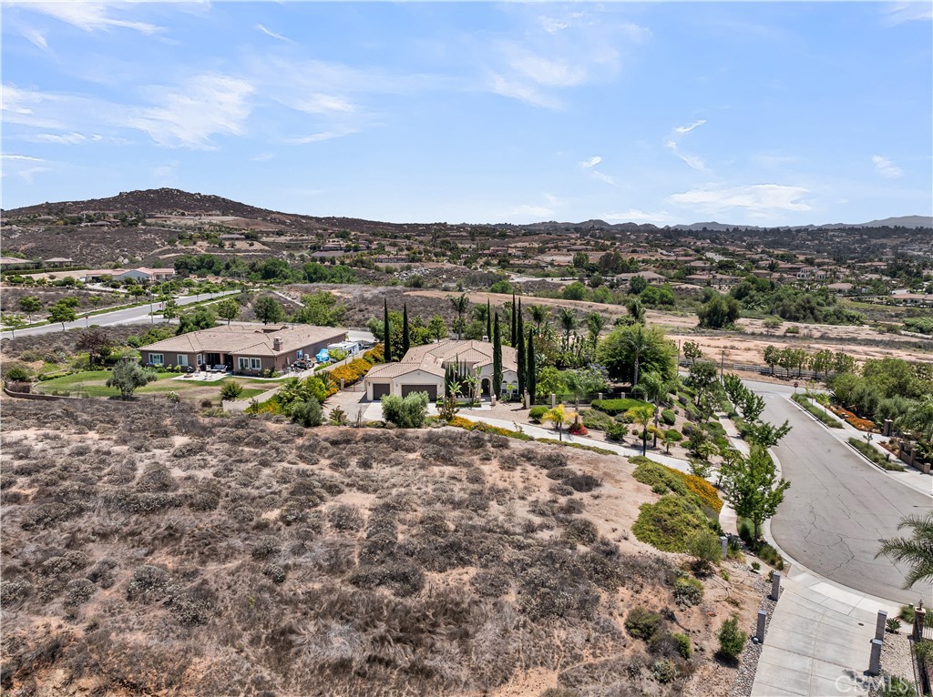 7780 Solitude Court Riverside, CA 92506 - Photo 59 of 63 a view of a dry yard with mountains in the background