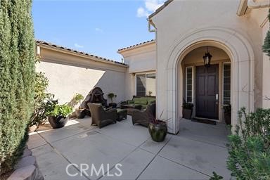 7780 Solitude Court Riverside, CA 92506 - Photo 7 of 63 a view of entryway with flower pots