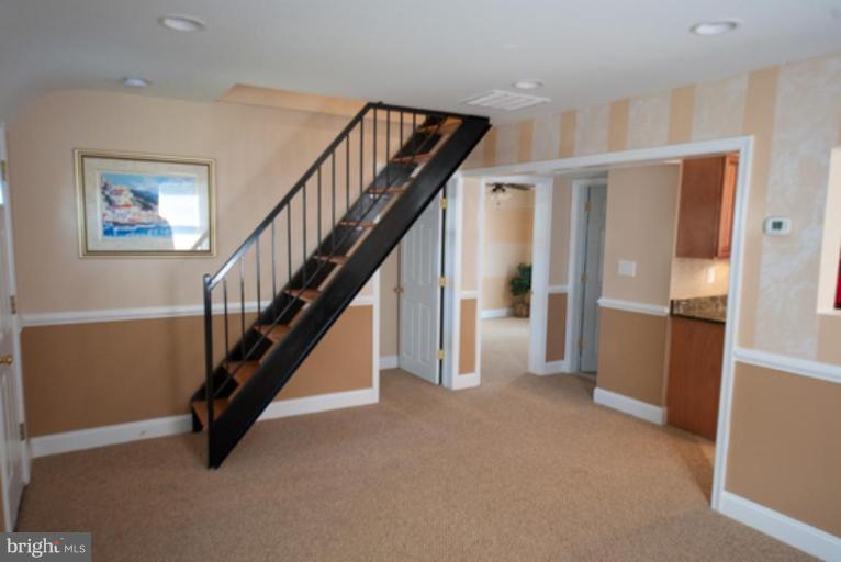 3127 Sollers Point Road Dundalk, MD 21222 - Photo 12 of 14 a view of entryway and hall with wooden floor