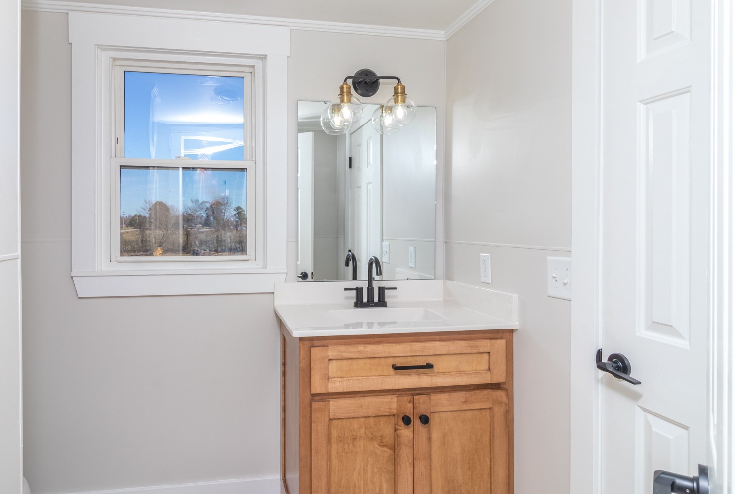 169 Dunn Fall River Road Leoma, TN 38468 - Photo 20 of 34 a bathroom with a sink vanity and a mirror