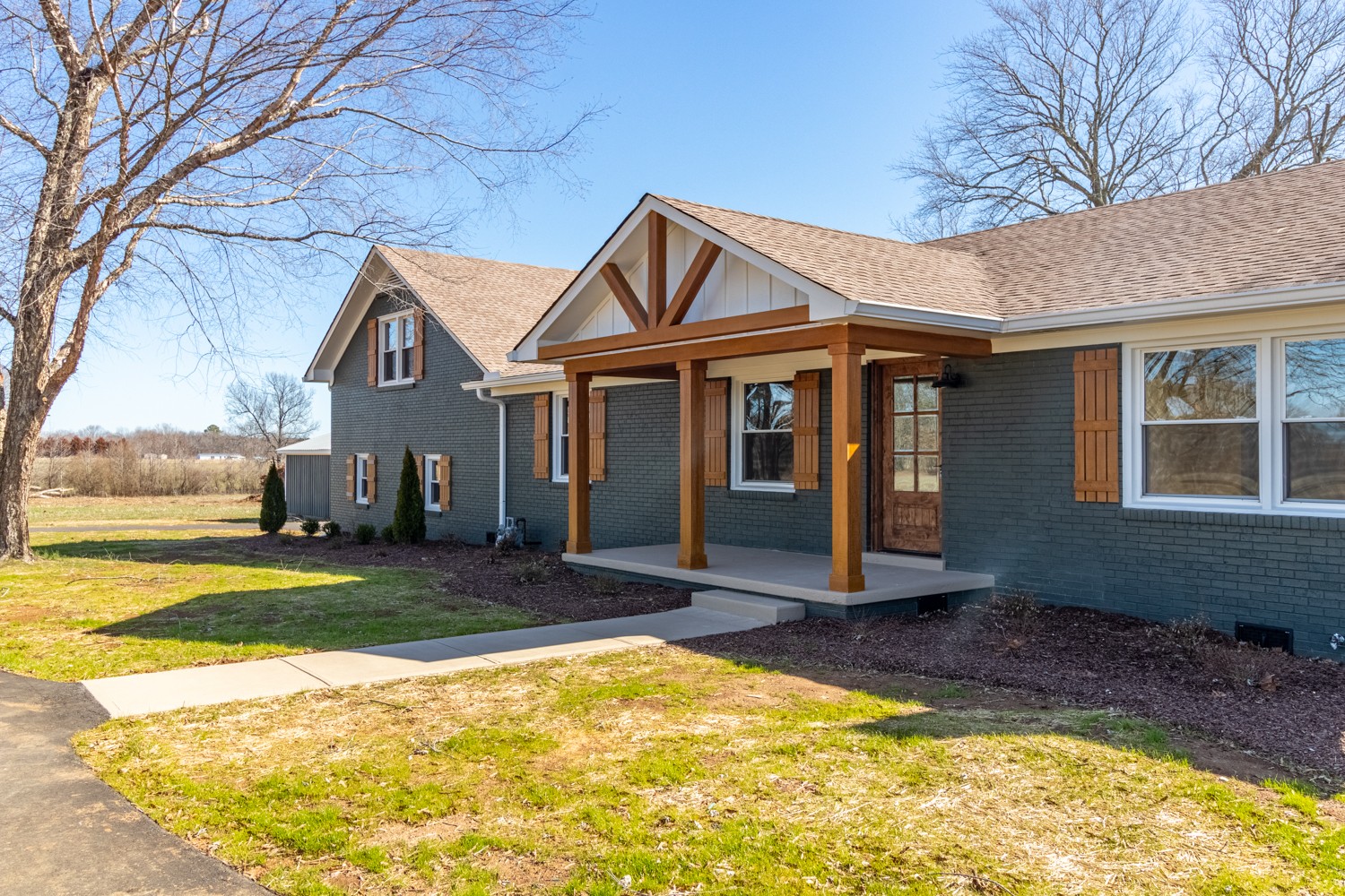 169 Dunn Fall River Road Leoma, TN 38468 - Photo 2 of 34 a front view of a house with a yard