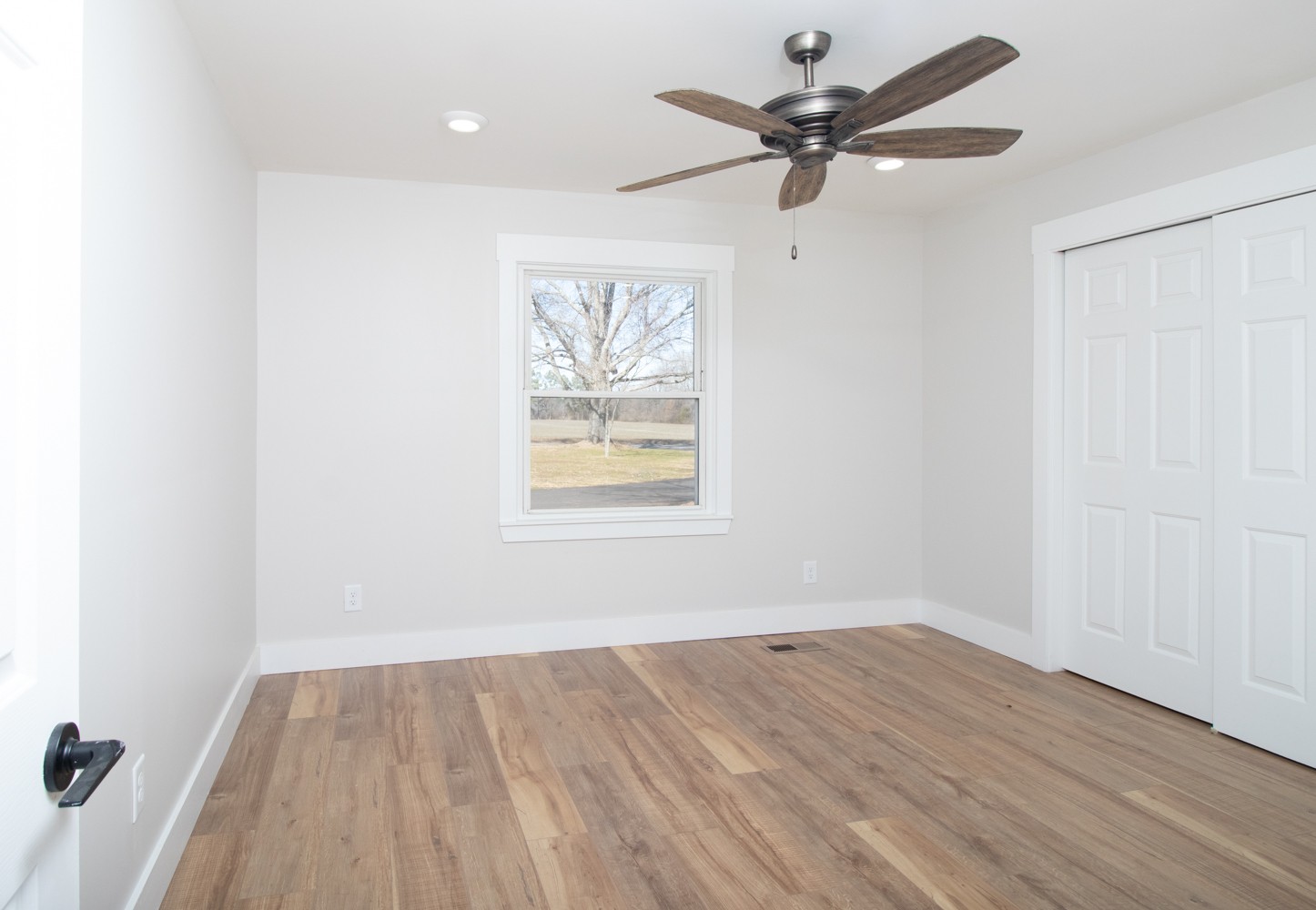 169 Dunn Fall River Road Leoma, TN 38468 - Photo 24 of 34 wooden floor in an empty room with a window