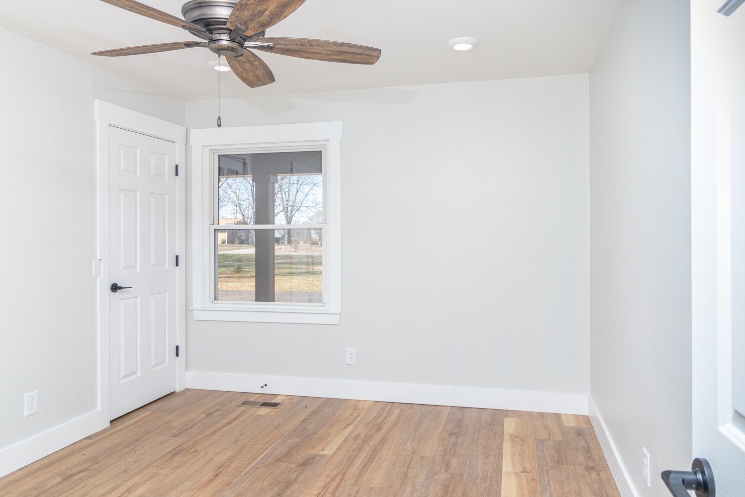 169 Dunn Fall River Road Leoma, TN 38468 - Photo 25 of 34 a view of an empty room with wooden floor and a window