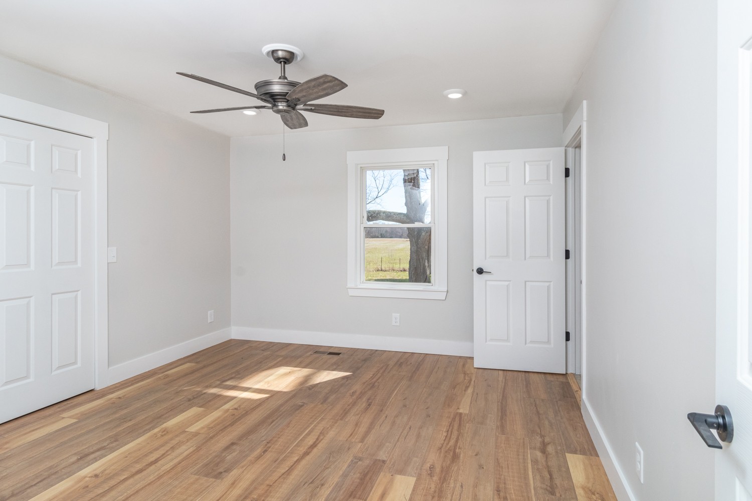169 Dunn Fall River Road Leoma, TN 38468 - Photo 29 of 34 a view of empty room with wooden floor and fan