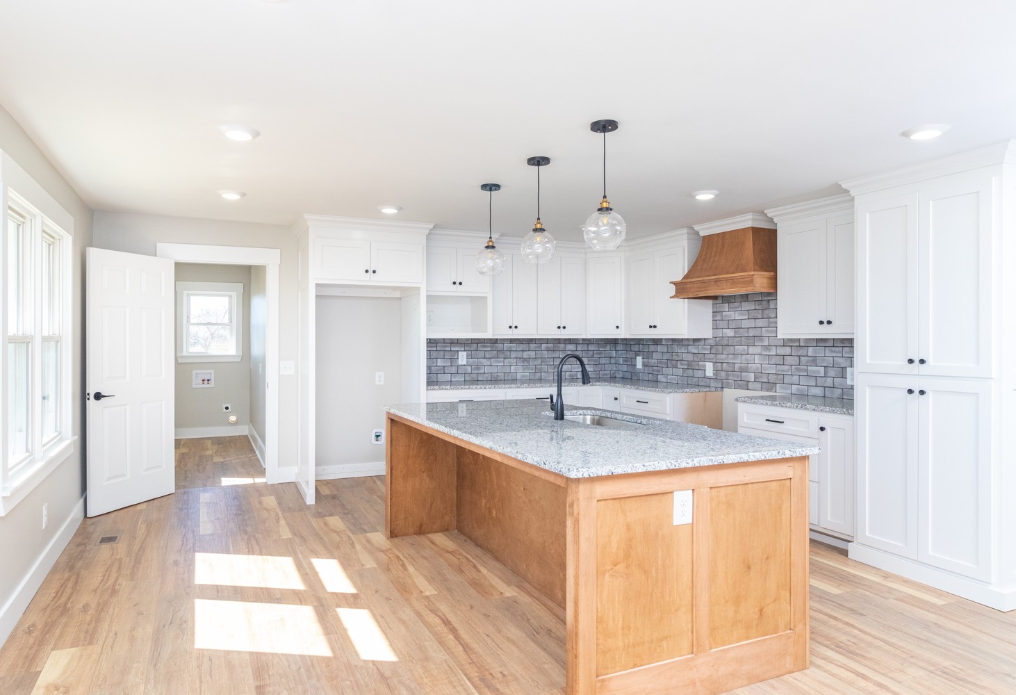 169 Dunn Fall River Road Leoma, TN 38468 - Photo 10 of 34 a kitchen with kitchen island granite countertop a sink and a refrigerator