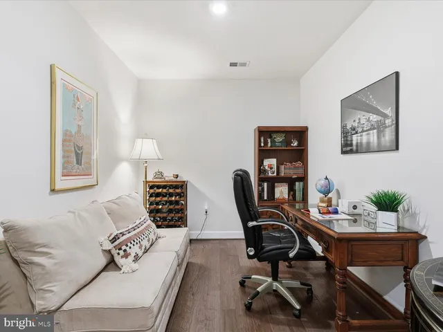 a view of a workspace with furniture and a couch