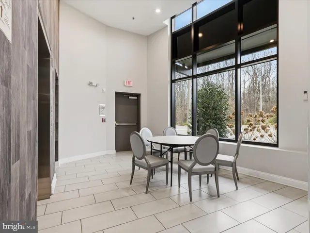 a view of a patio with a table and chairs
