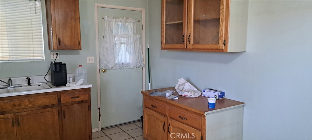 281 North Pine Street Pixley, CA 93256 - Photo 12 of 14 a room with storage and utility