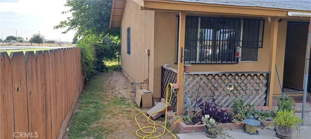 a view of a house with a potted plant