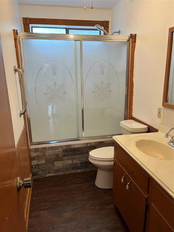 1401 Linton Road Benton, LA 71006 - Photo 15 of 19 a bathroom with a sink a toilet and mirror