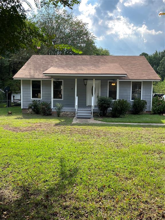 1401 Linton Road Benton, LA 71006 - Photo 3 of 19 a front view of a house with a yard