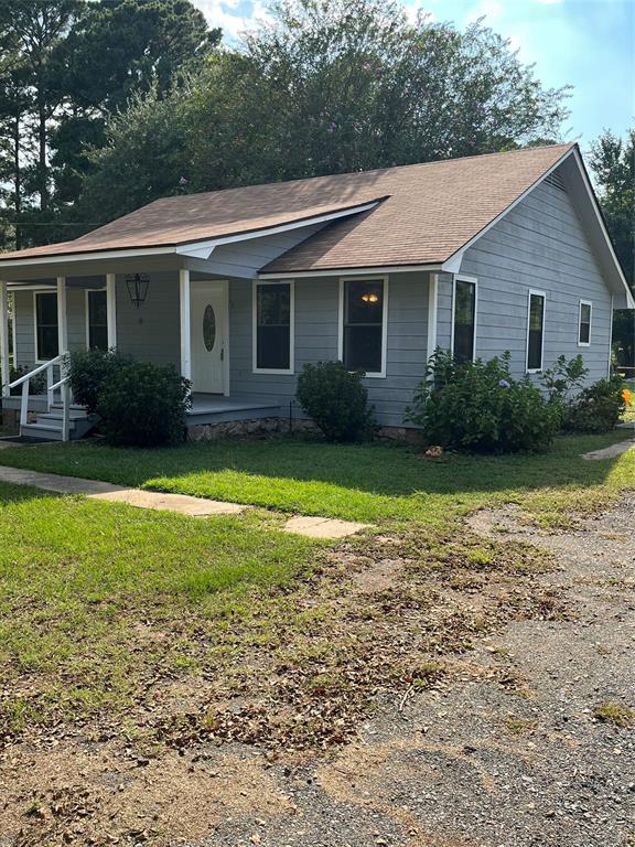 1401 Linton Road Benton, LA 71006 - Photo 5 of 19 a view of a house with a yard and plants