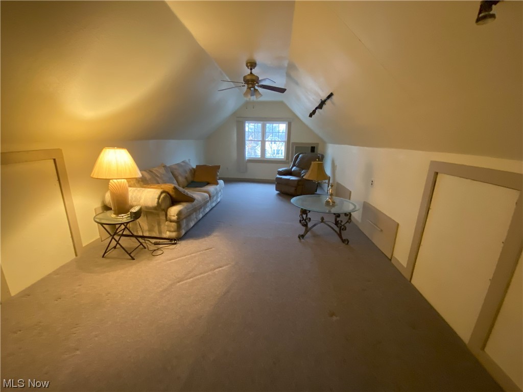 3650 Hildana Road Cleveland, OH 44120 - Photo 16 of 20 Additional living space featuring lofted ceiling, ceiling fan, and light colored carpet