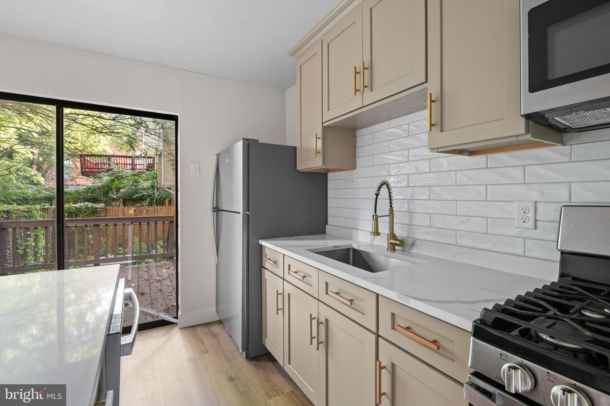 322 South Poppleton Street Baltimore, MD 21230 - Photo 11 of 34 Modern kitchen with serene views.
