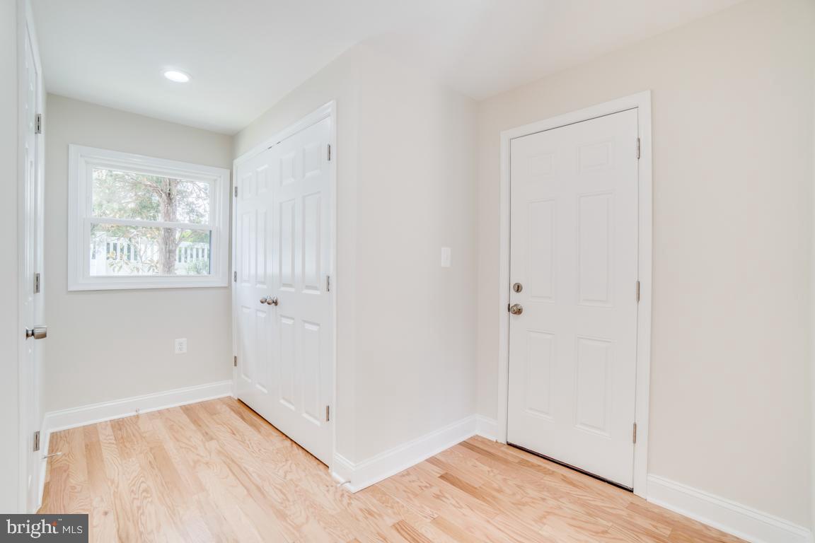 2105 Windsor Road Alexandria, VA 22307 - Photo 40 of 41 Mudroom with half bath, full size W/D, coat closet