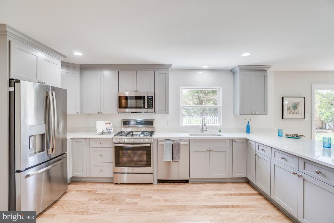 2105 Windsor Road Alexandria, VA 22307 - Photo 9 of 41 GE Profile gas range and French-door fridge