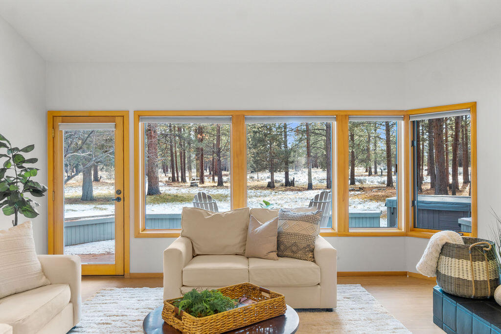 60013 West Ridgeview Drive Bend, OR 97702 - Photo 11 of 43 A wall of windows and access out to the back deck and property.