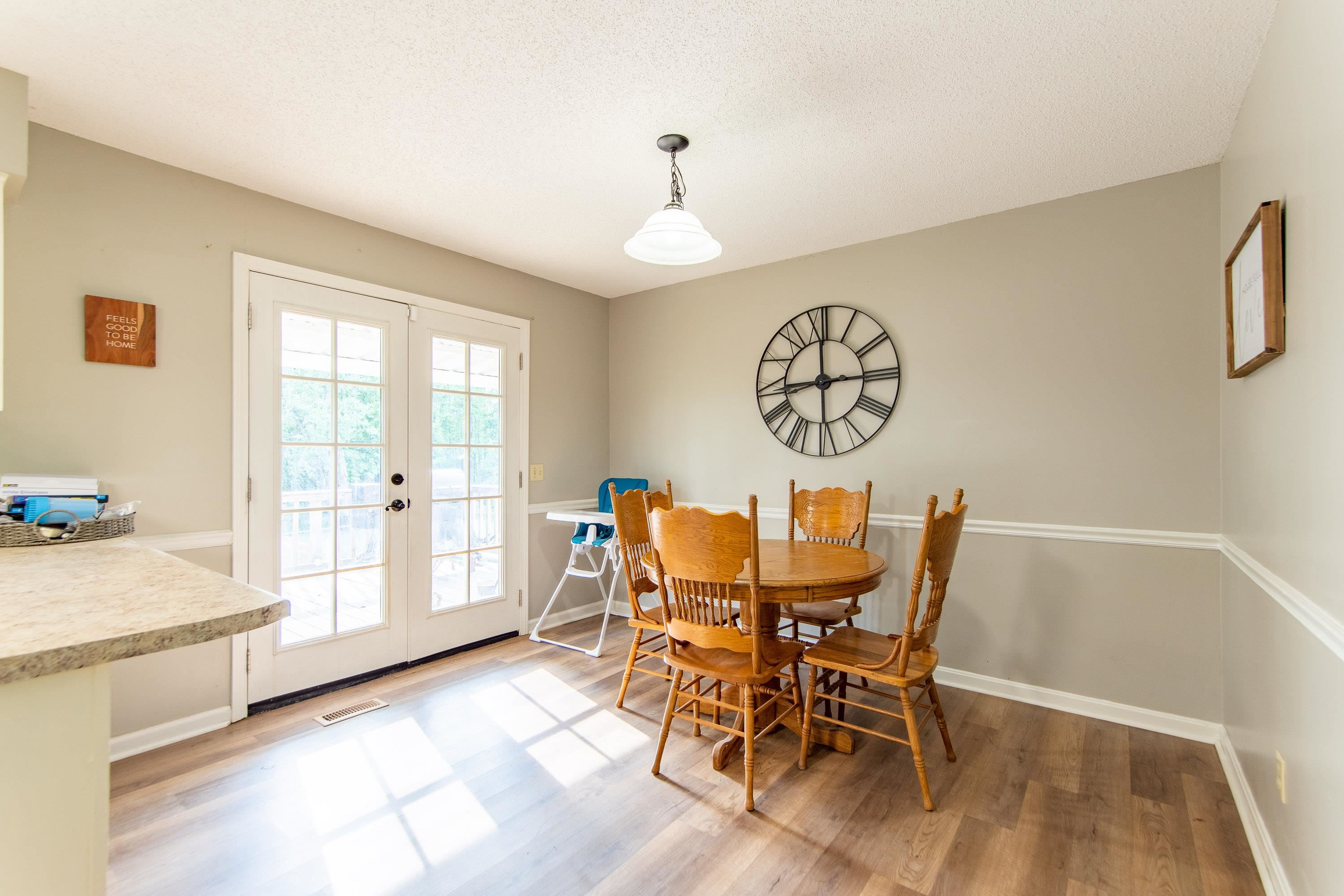 334 Neely Sharp Road Adamsville, TN 38310 - Photo 5 of 25 a view of a dining room with furniture window and wooden floor