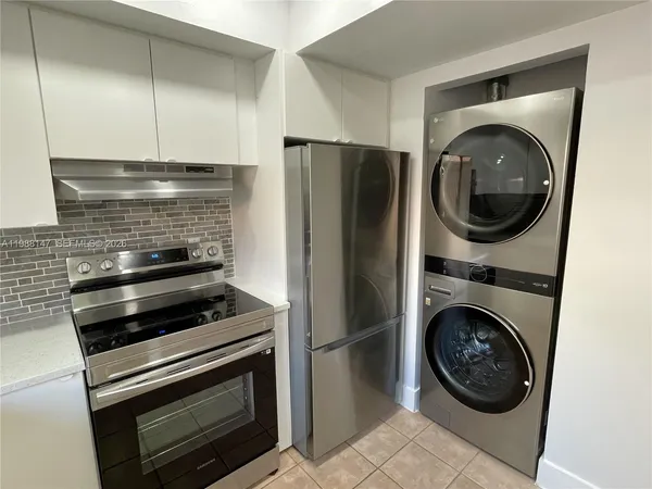 a kitchen with a washer and dryer
