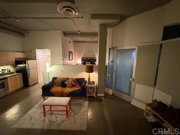 a kitchen with a refrigerator and a sink