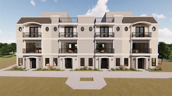 a front view of a residential apartment building with a street