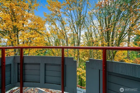 a view of a wooden fence and trees