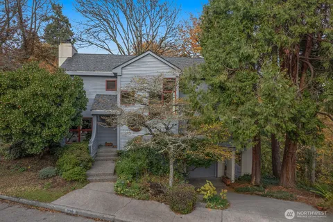 front view of a house with a tree