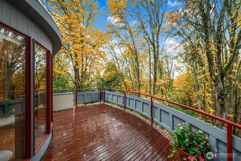 a view of a balcony with wooden floor