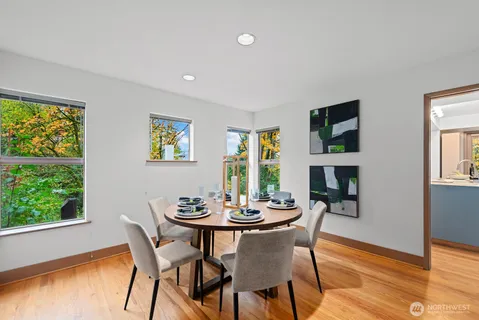 a dining room with furniture and window