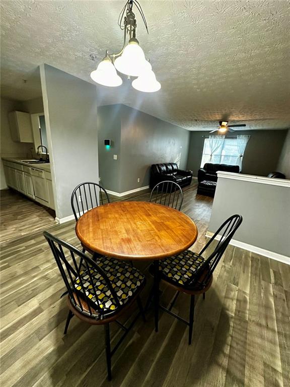 16103 Waldrop Cove Decatur, GA 30034 - Photo 6 of 17 a view of a dining room with furniture and a chandelier