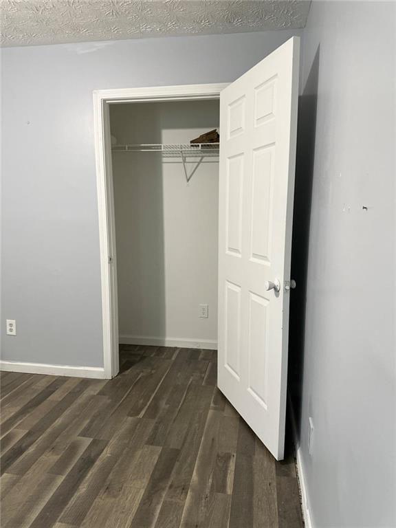 16103 Waldrop Cove Decatur, GA 30034 - Photo 9 of 17 an empty room with wooden floor and closet