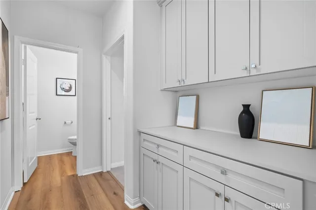 a bathroom with a sink toilet and a mirror