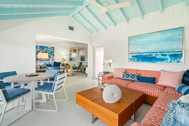 a living room with furniture and a rug