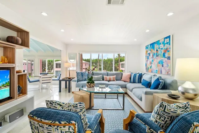 a living room with furniture fireplace and a flat screen tv