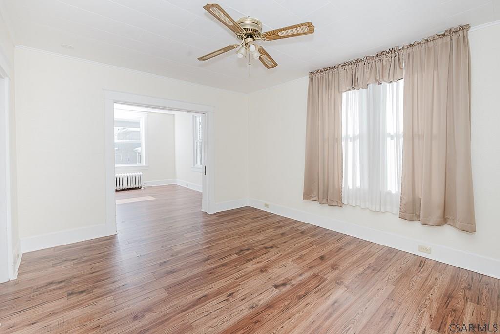 159 Wilson Street Johnstown, PA 15906 - Photo 8 of 27 wooden floor in an empty room with a window