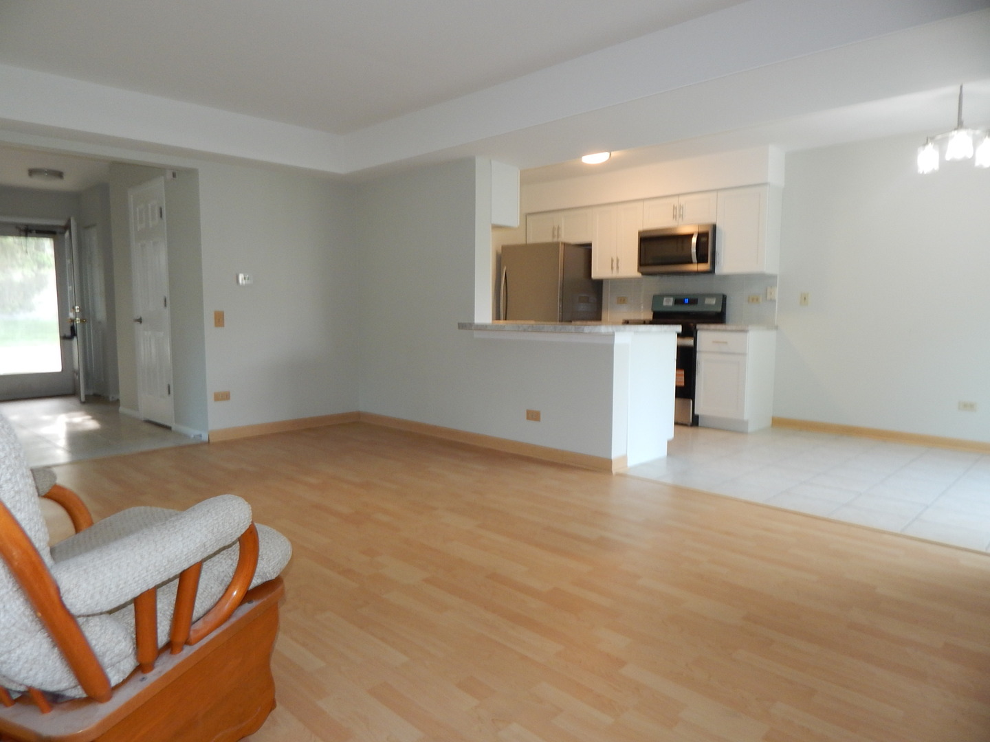 1 North Oltendorf Road Streamwood, IL 60107 - Photo 5 of 18 a view of kitchen with furniture and flat screen tv