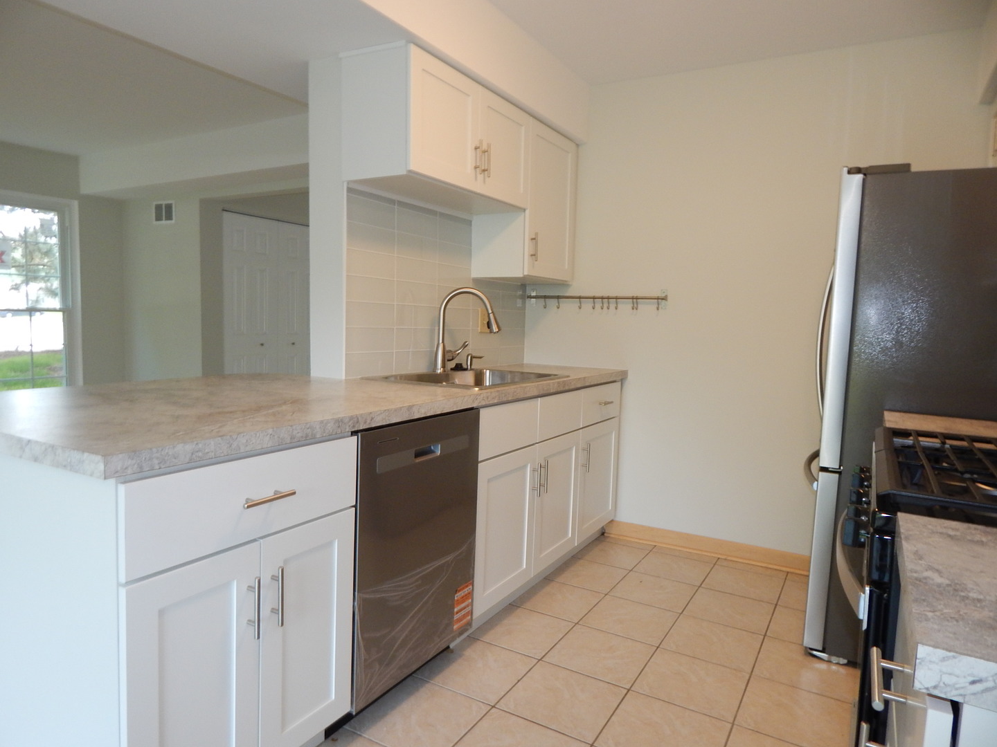 1 North Oltendorf Road Streamwood, IL 60107 - Photo 7 of 18 a kitchen with a sink cabinets and appliances