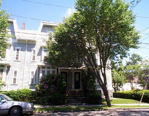 378 Atlantic Street, Unit A5 Bridgeport, CT 06604 - Photo 1 of 1 a front view of a house with trees