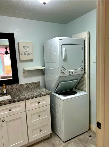 a bedroom with a bed and wooden floors