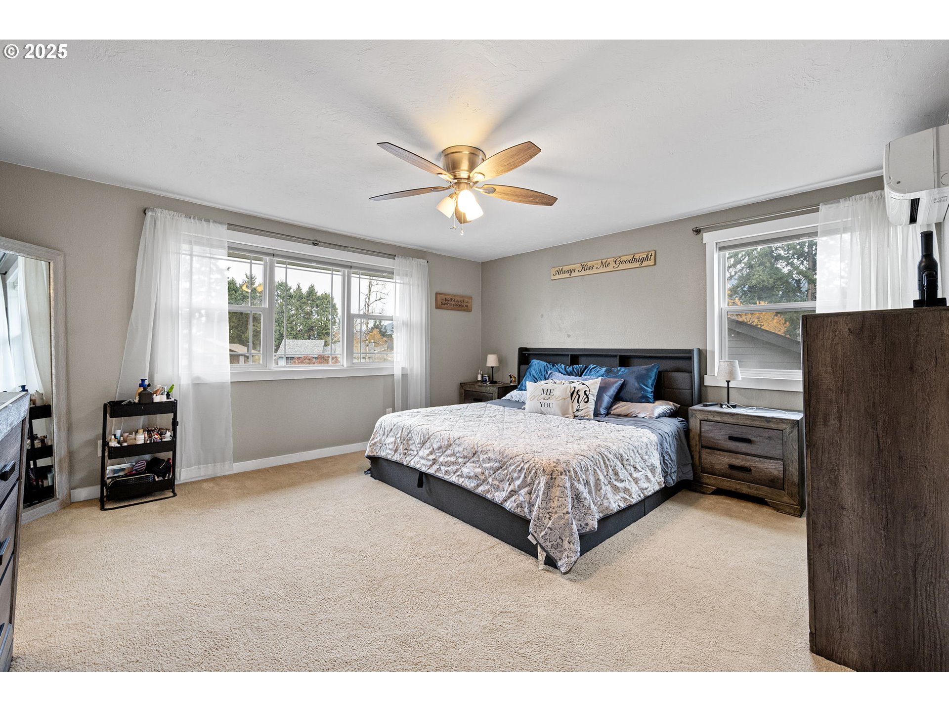296 65th Street Springfield, OR 97478 - Photo 12 of 33 a bedroom with a bed and a tv
