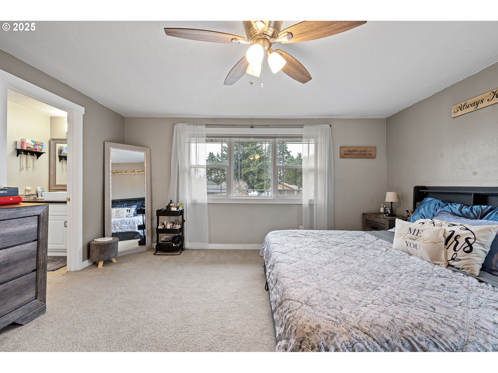 296 65th Street Springfield, OR 97478 - Photo 13 of 33 a bedroom with a bed and a chandelier
