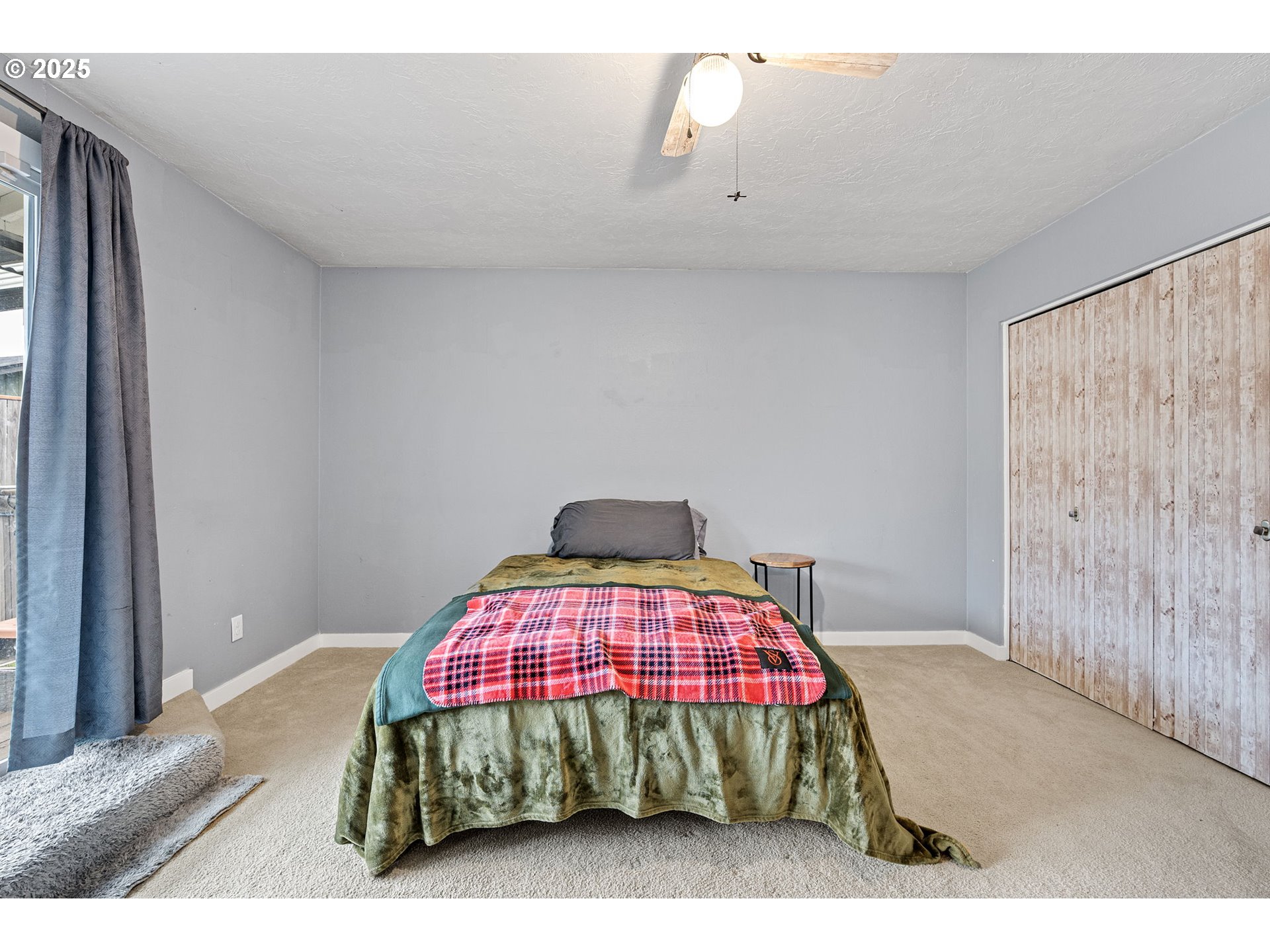 296 65th Street Springfield, OR 97478 - Photo 19 of 33 a bedroom with a bed and a window